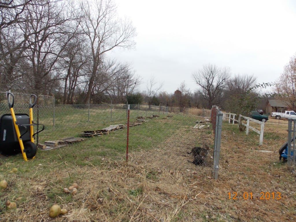 Preschool garden before it was built with just fencing
