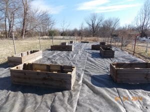 a few raised beds on landscape fabric, preschool garden building