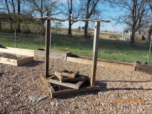 herb tower with pergola built out of upcycled found materials