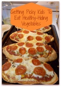 french bread pizzas with hidden vegetables on a sheet pan