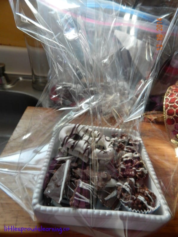 gift packaging for chocoaltes, small bowl full of chocolates and being wrapped up in a cello bag.
