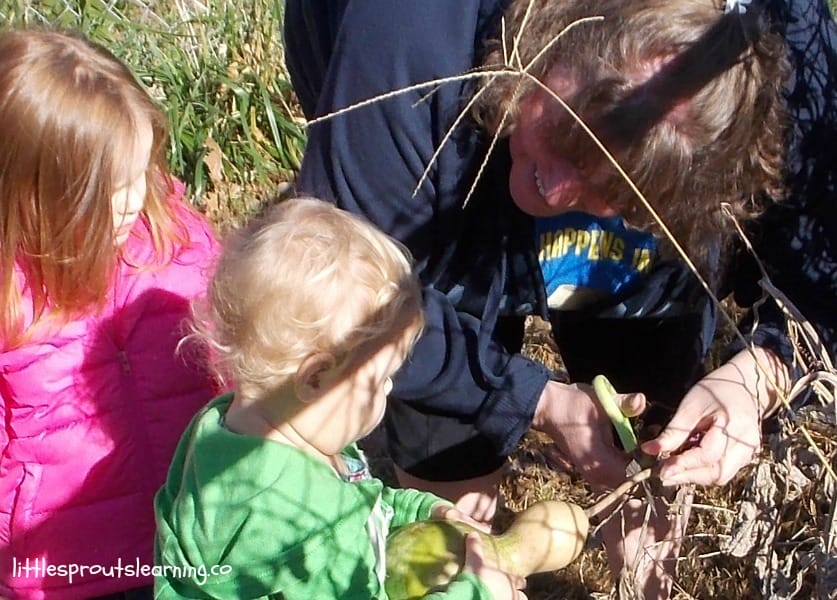daycare provider interacting with children in the garden