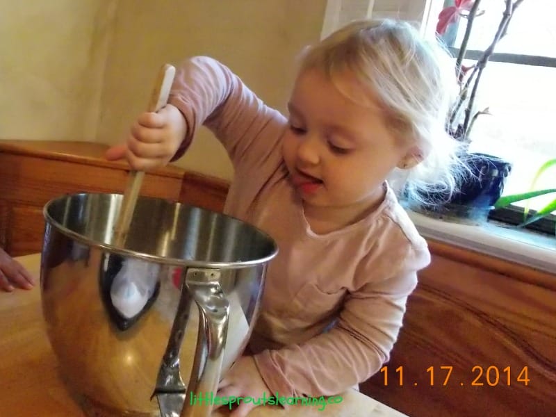 child stirring mixture