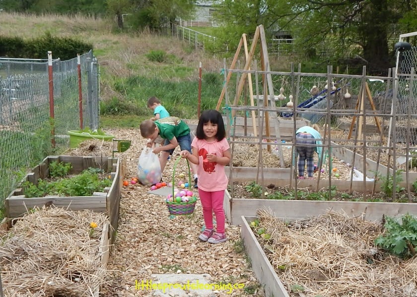 Kids hunting easter eggs in the children's garden