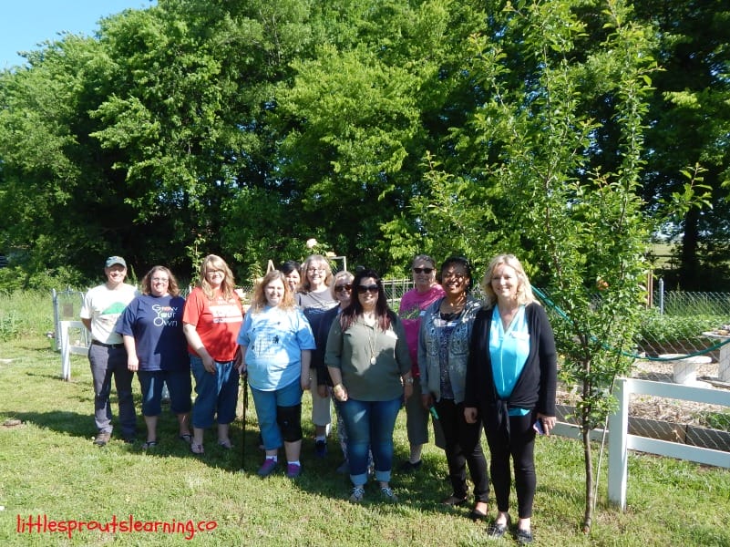 Childcare providers touring children's gardens