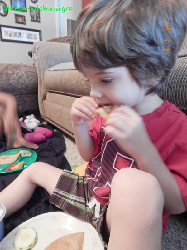 eating quesadillas at indoor picnic