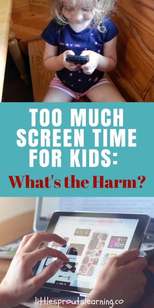 child playing on a phone and a child playing on a tablet in front of a computer.