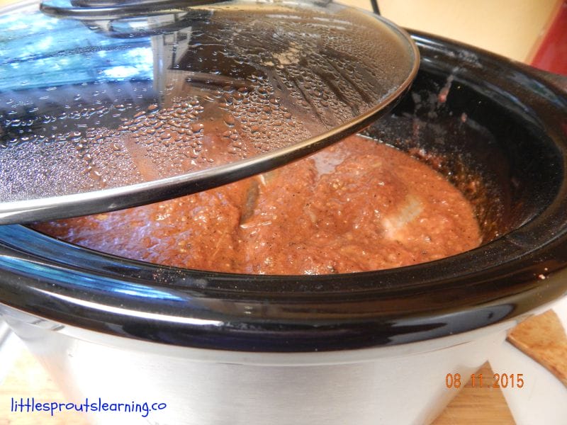pork roast cooking in the crock pot for kid friendly dinner