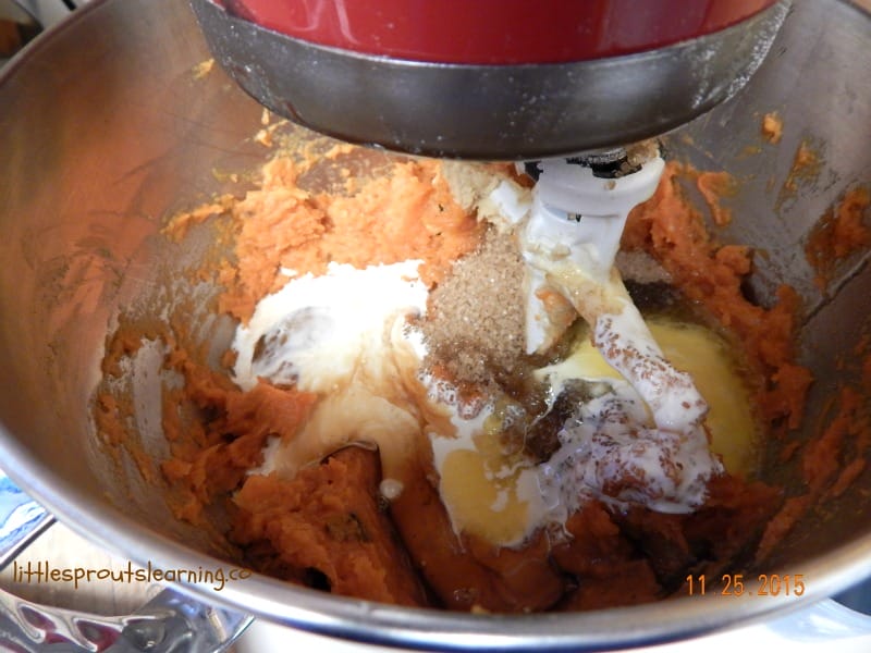 sweet potato casserole being mixed up in a kitchen aid mixer
