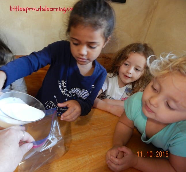 kids putting cream in a bag for ice cream in a bag
