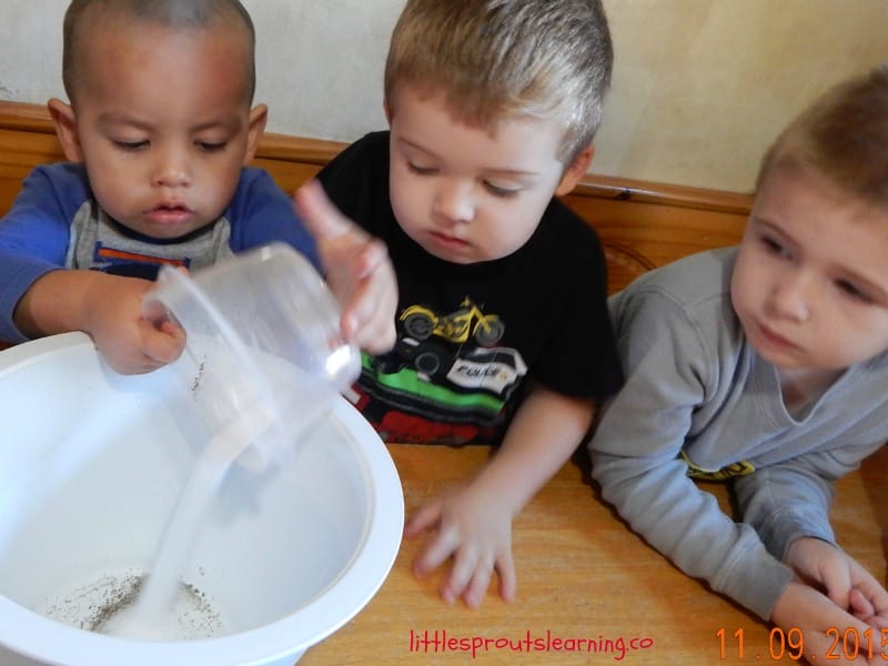 Kids pouring salt into egg and vegetable casserole