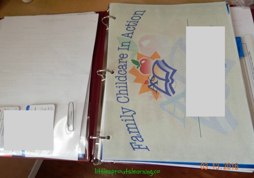 daycare paperwork organized in notebook