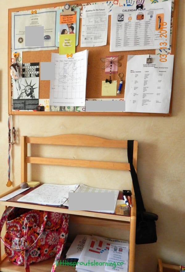 organizing daycare paperwork, bulletin board and paperwork notebook full of daycare paperwork