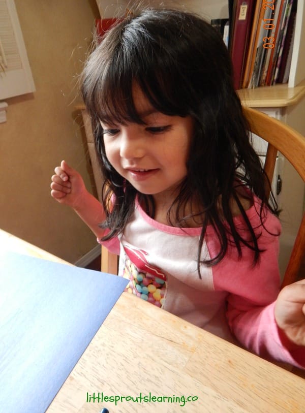 paper, crayons and materials for a child to create with. ONe child using them.