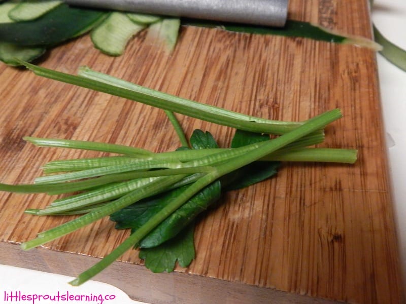 herb stems on a cutting board