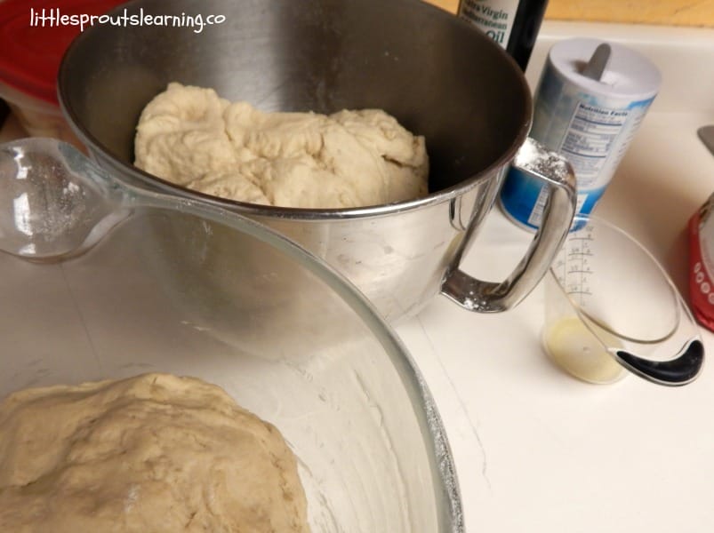 dough in bowls and ingredients setting next to them on the counter