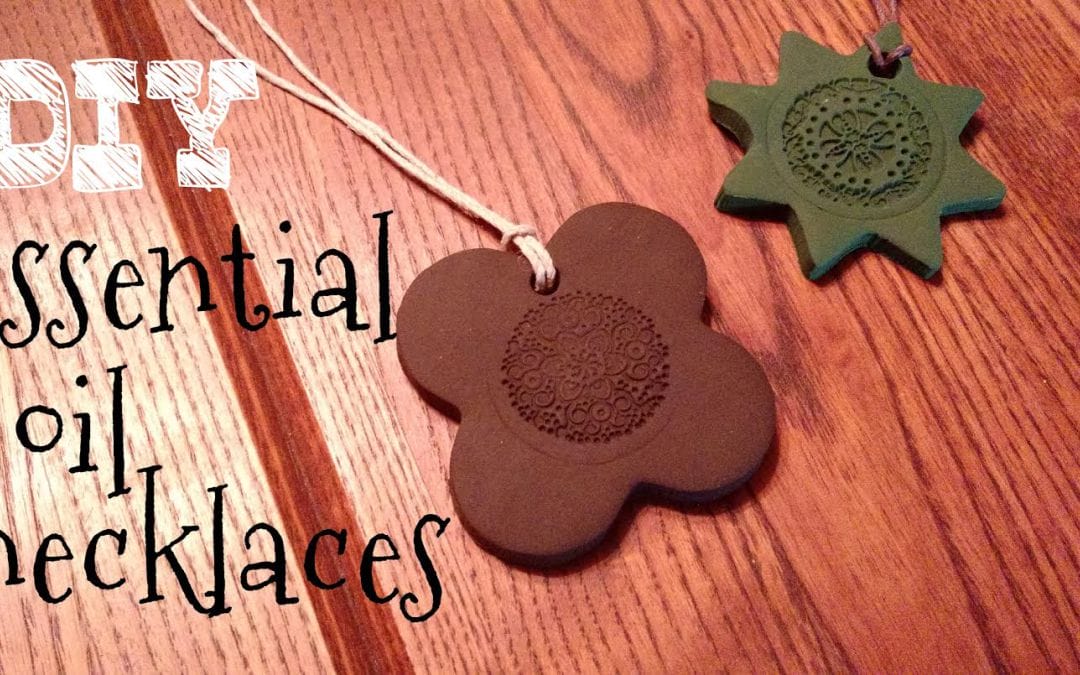 essential oil necklaces to give as gifts laying on a table