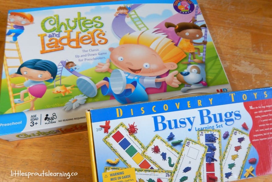 chutes and ladders and busy bugs games on the table