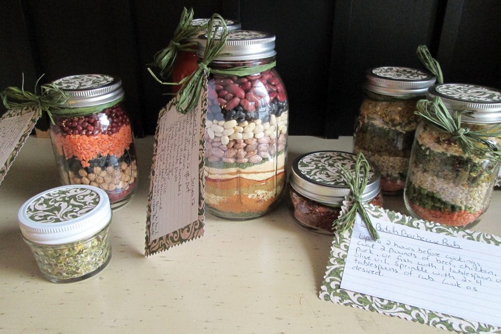 gifts mixes in mason jars of various sizes with spices, beans, and pastas
