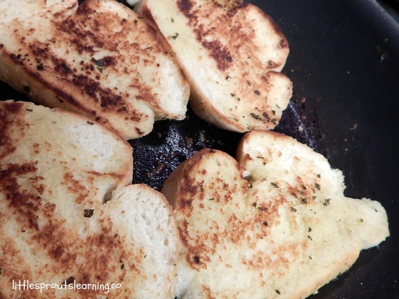 toasting bread slices in the skillet for pulled pork sandwich recipe