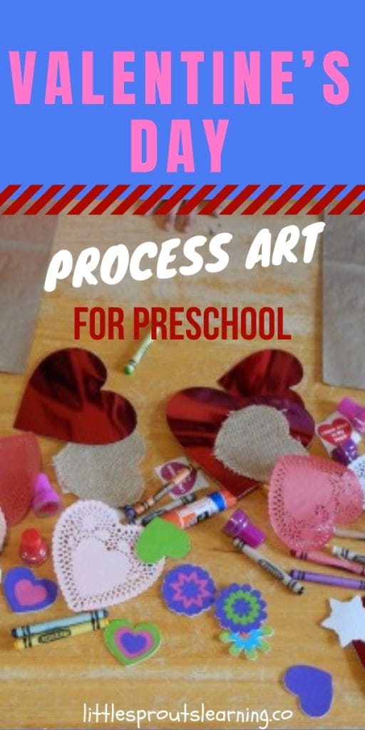 Valentine's day process art materials on a table. Glue, scissors, stickers, shapes, crayons, stamps and more.