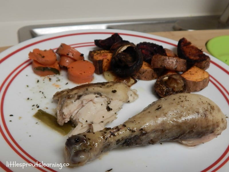 roasted chicken thigh and leg with some vegetables from the crock pot