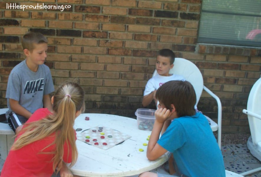 kids playing games on the homemade stepping stone patio