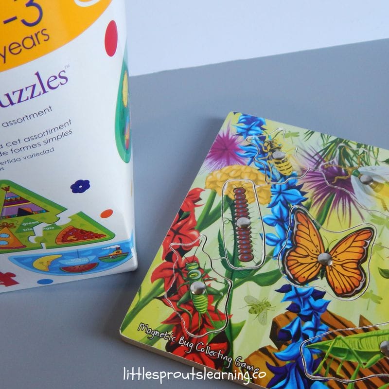 puzzle gifts for preschoolers, a wooden puzzle and some cardboard puzzles on the table.