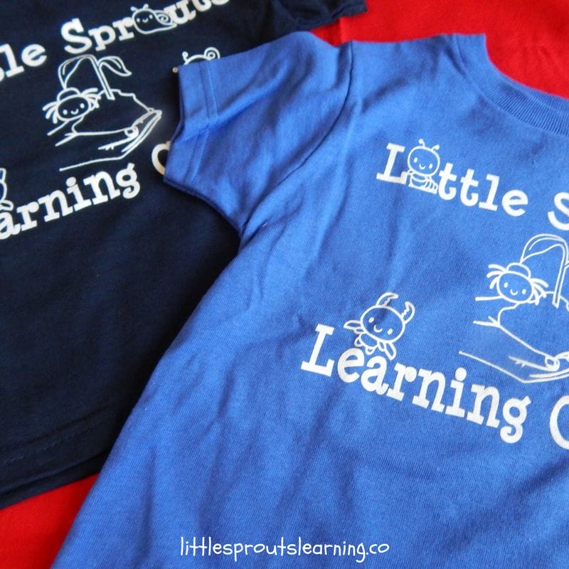Little Sprouts t-shirts on a table for advertising family child care
