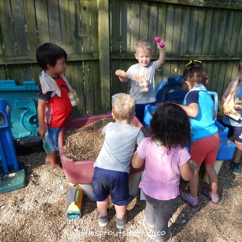 kids hunting for dinosaur eggs at the ultimate dinosaur party for kids