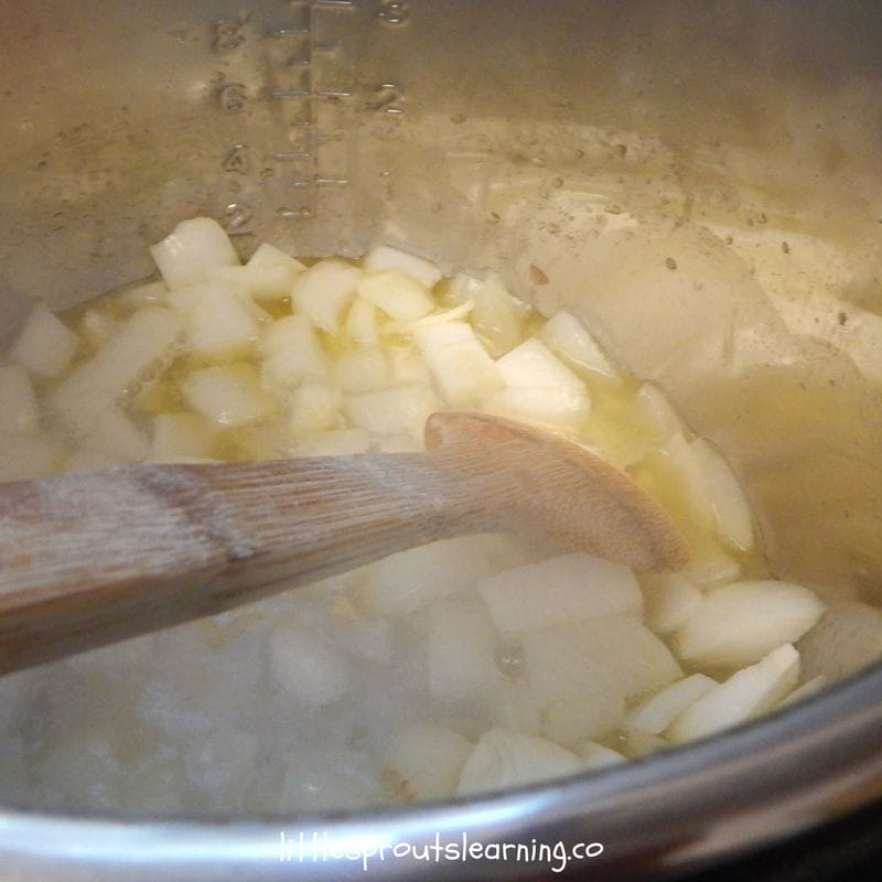 onions sauteing in instant pot for chicken tortilla soup