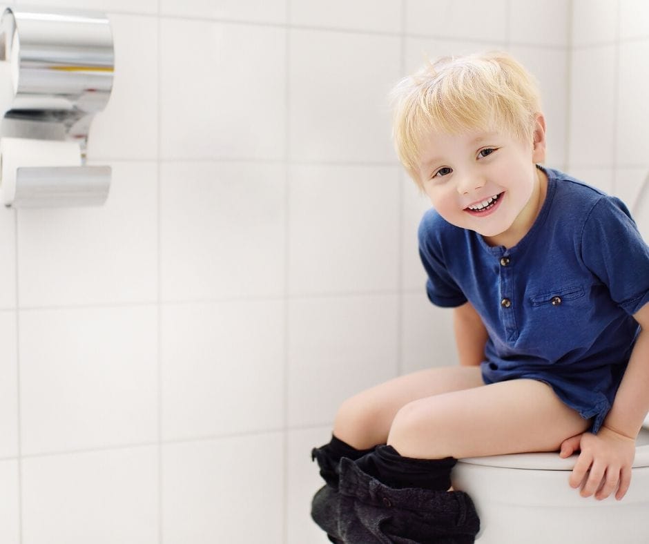 child sitting on the big potty learning to use it