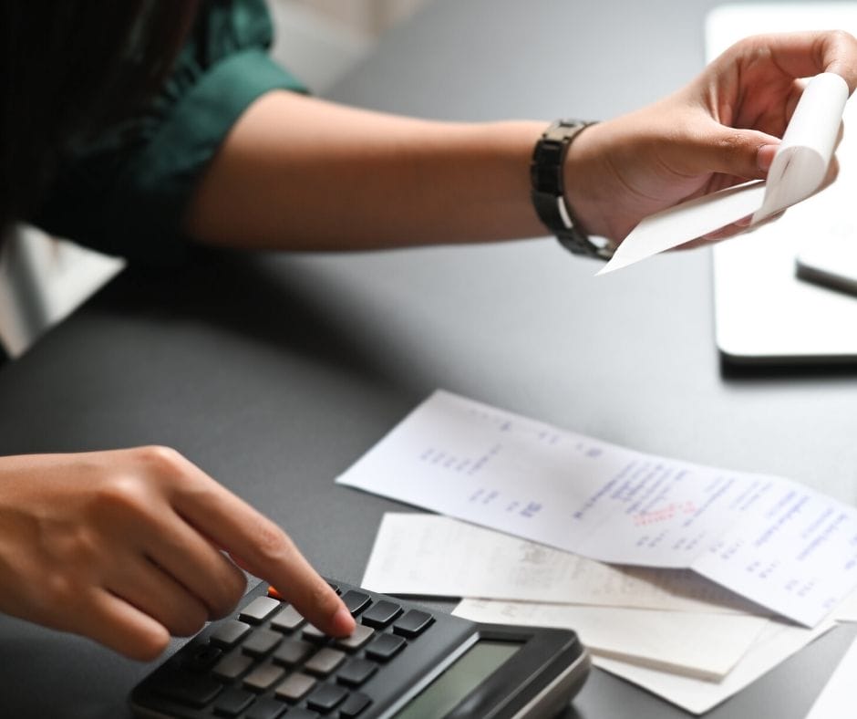 expense receipts for home daycare and a woman calculating totals