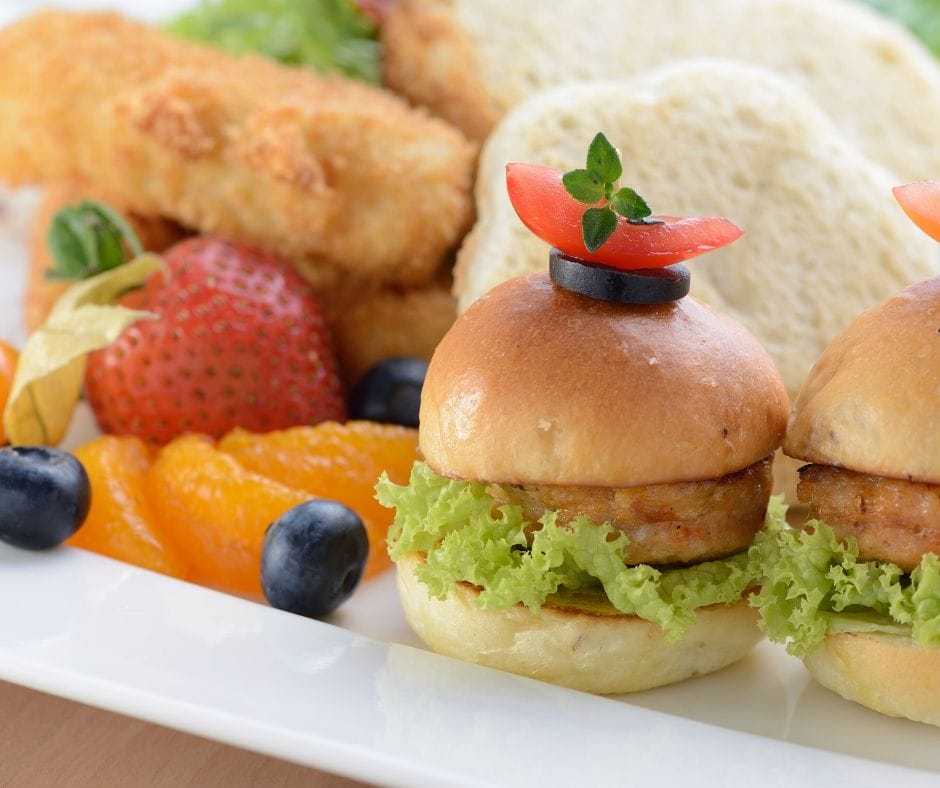 sliders on a plate with fruit for meals for kids