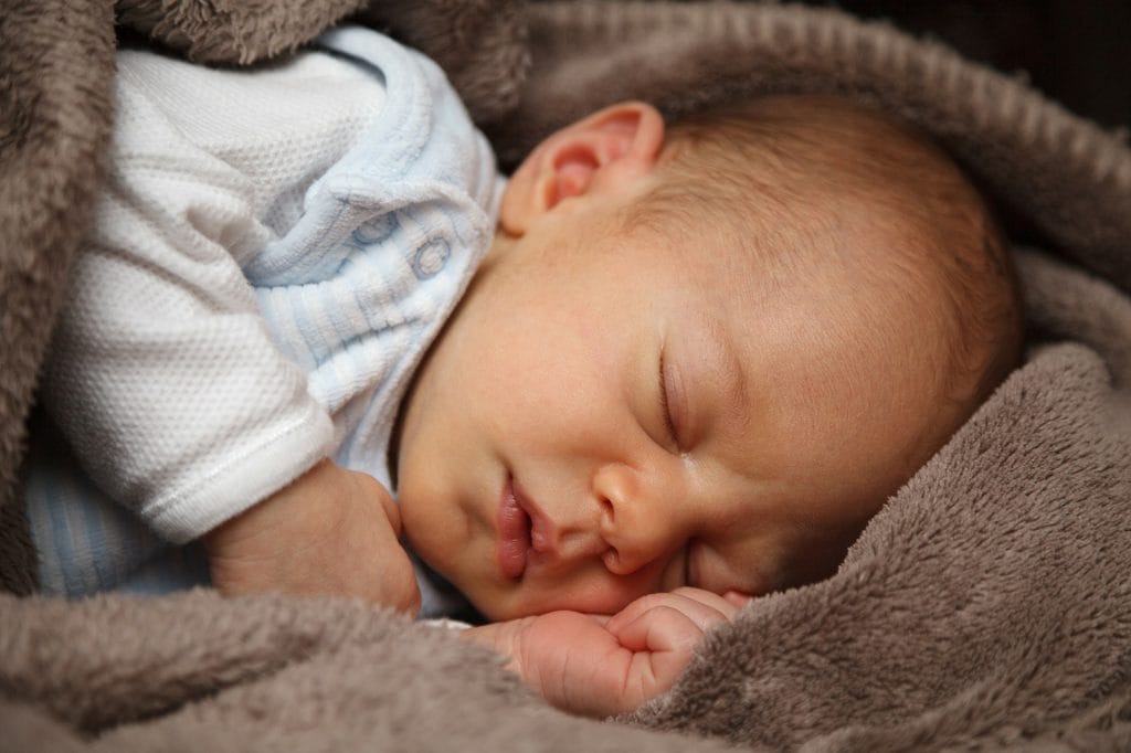 sweet baby sleeping in fuzzy blanket, baby christmas gifts