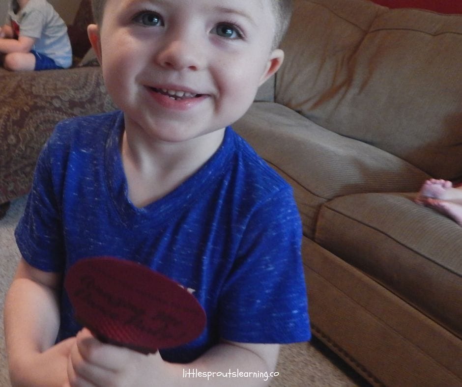a child with a homemade microphone