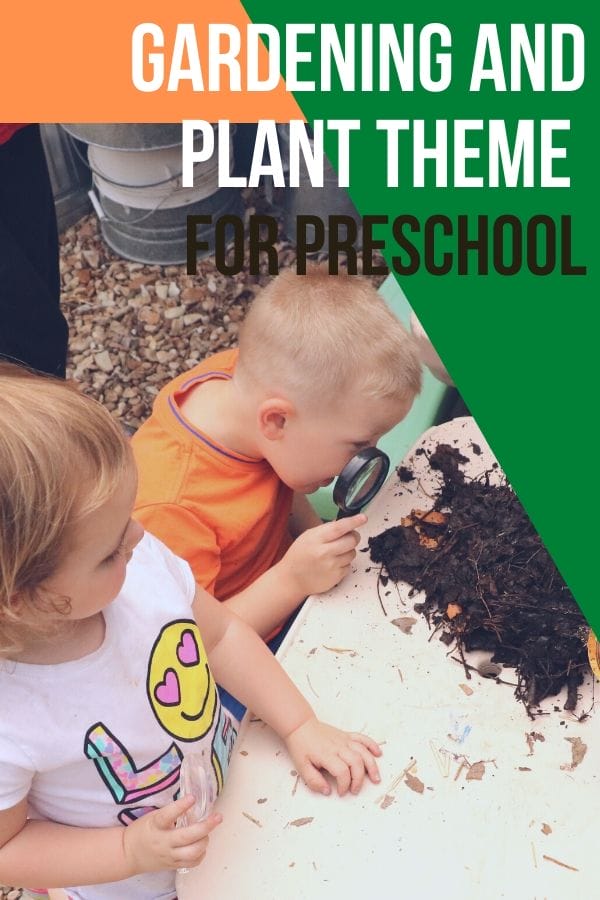 kids looking at compost with a magnifying glass. 