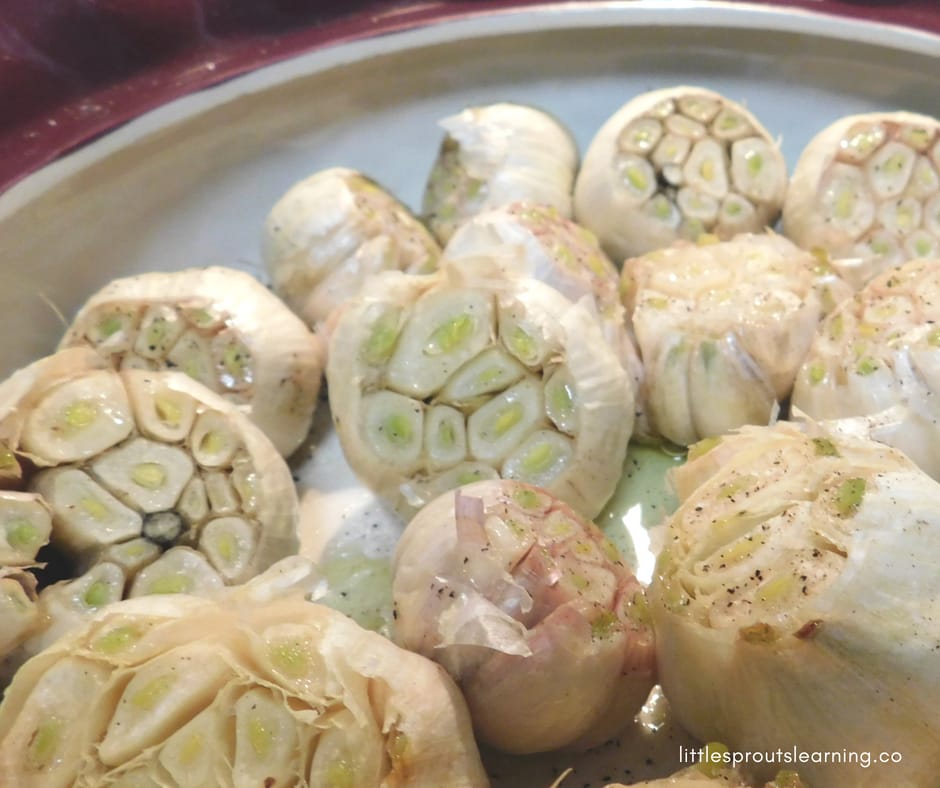 pan full of roasted garlic heads