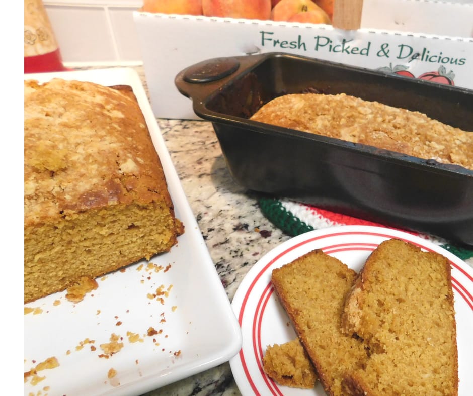 peach pumpkin cobbler bread on a plate with loaf next to it, peaches