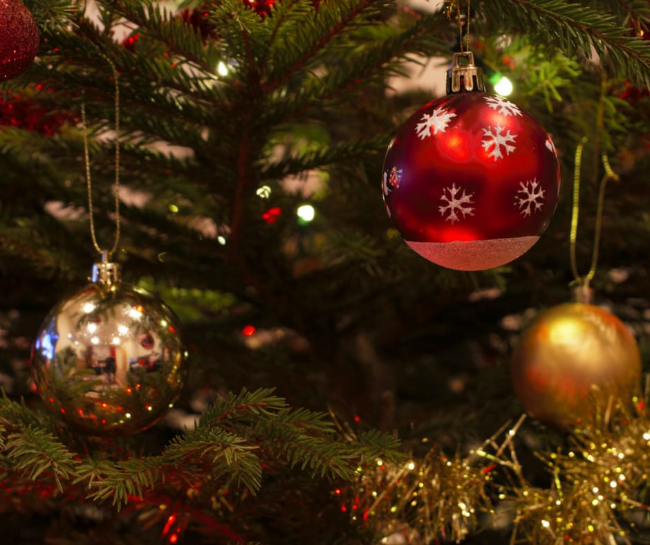 christmas ornaments on a tree with lights twinkling, baby stocking stuffers