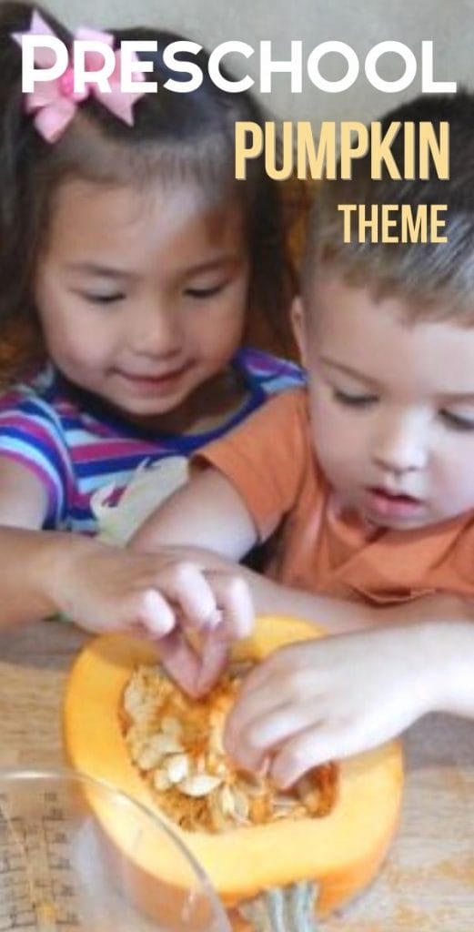 kids exploring the insides of a pumpkin at the table
