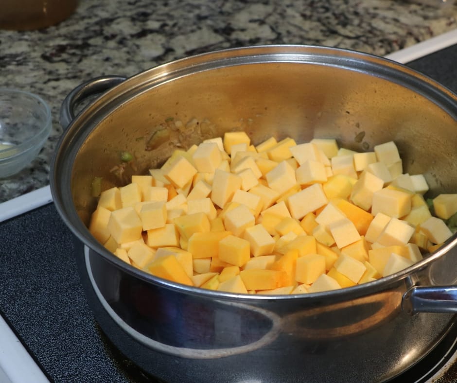 cubed butternut squash in a pan on the stove