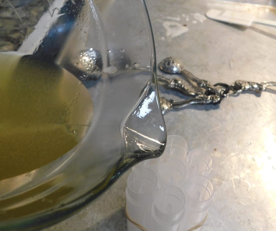 pouring lip balm into tubes