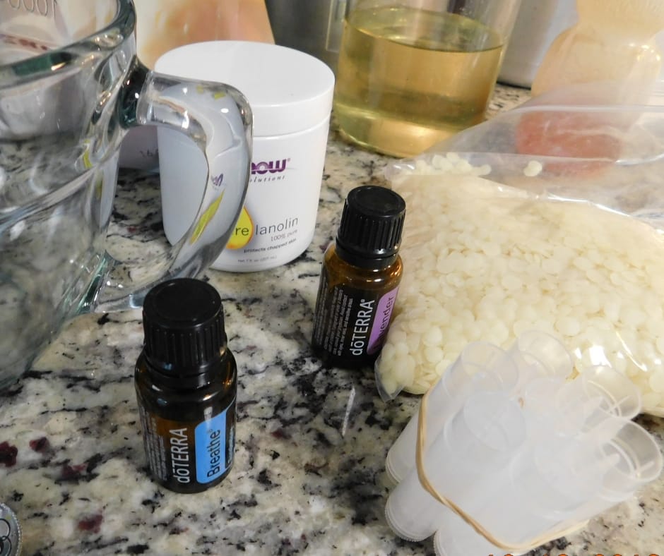 lip balm ingredients, lavender, lanolin, shea butter on counter