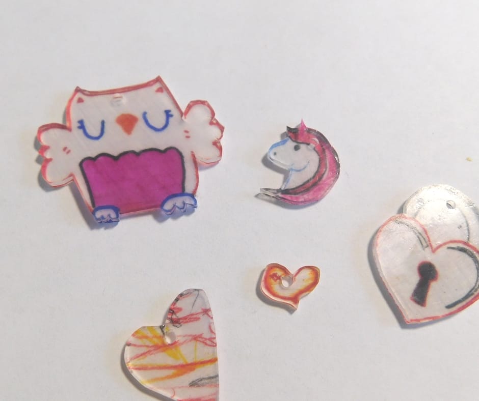 fresh baked shrink art, owl, unicorn, hearts.