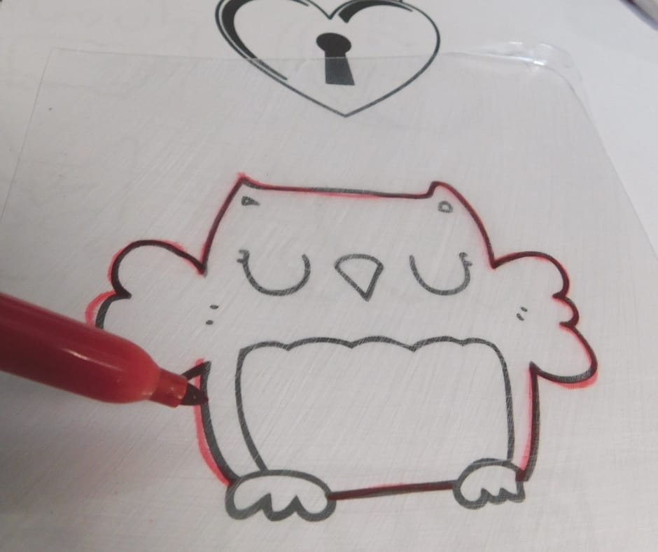Tracing owl with Sharpie.