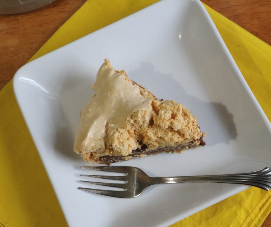 slice of grandma's chocolate pie on a plate with a fork