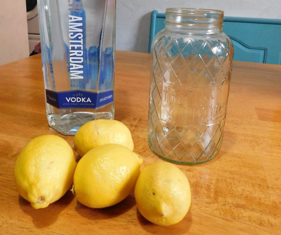 lemon extrac supplies, vodka, lemons and a jar