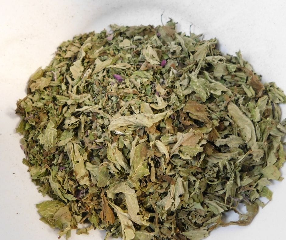 bowl of dried herbs ready to blend and put in jars