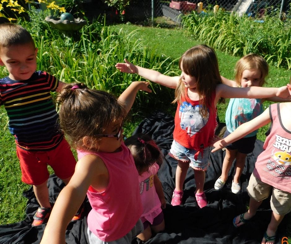 kids in the garden doing yoga